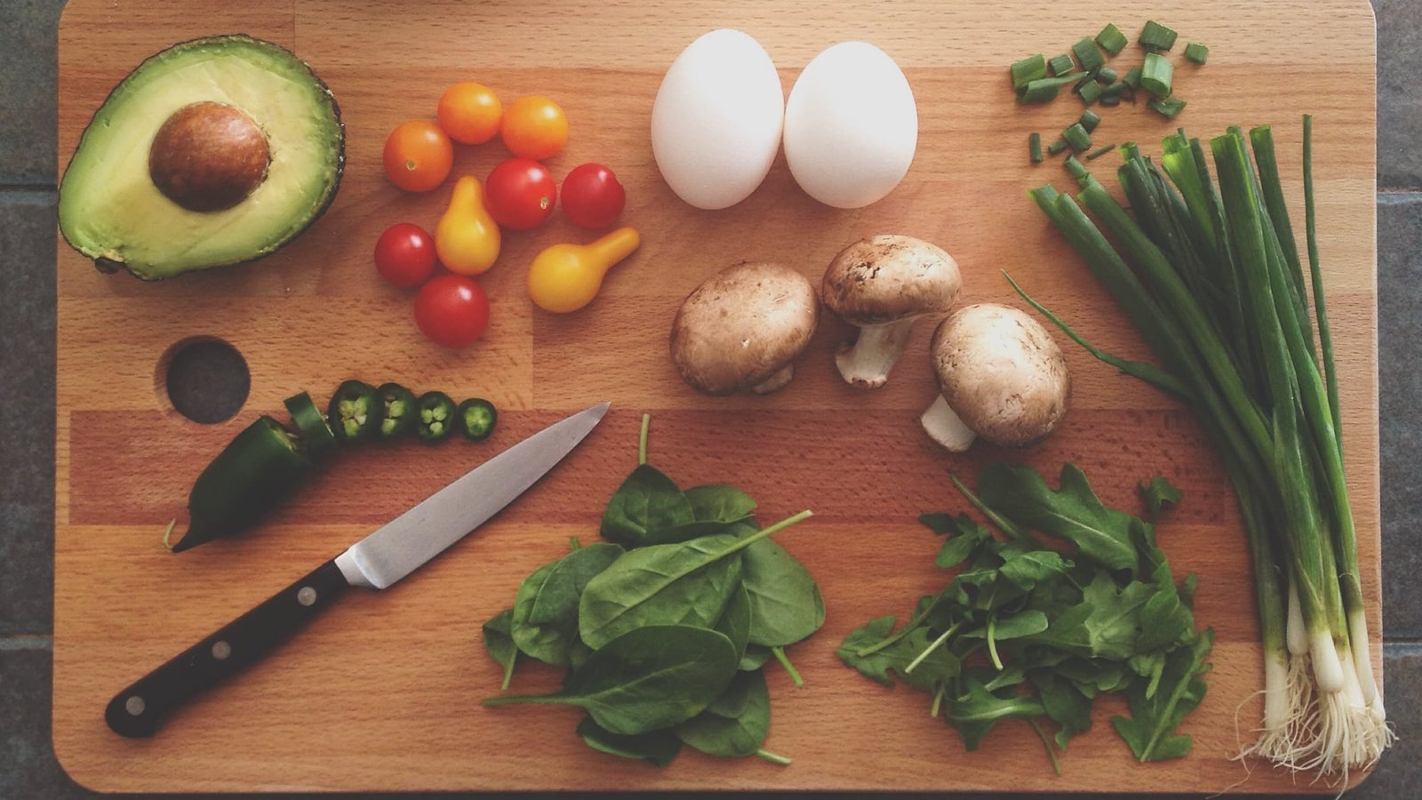 Whole foods including eggs, avocado, mushrooms and leafy greens for high quality nutrition and gut health.