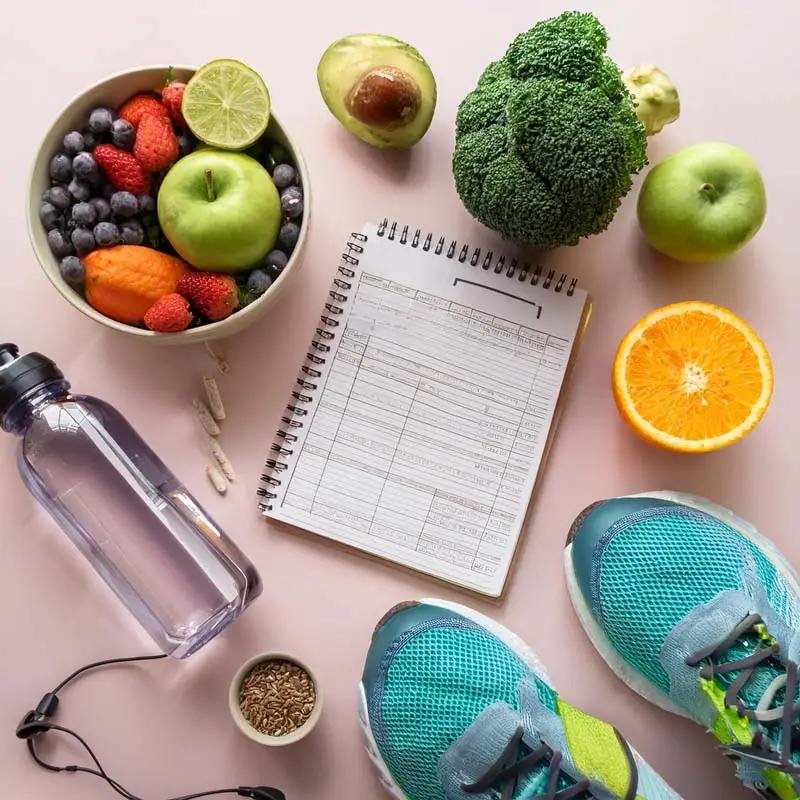 tems representing healthy lifestyle habits including hydration, exercise and nutritious food.