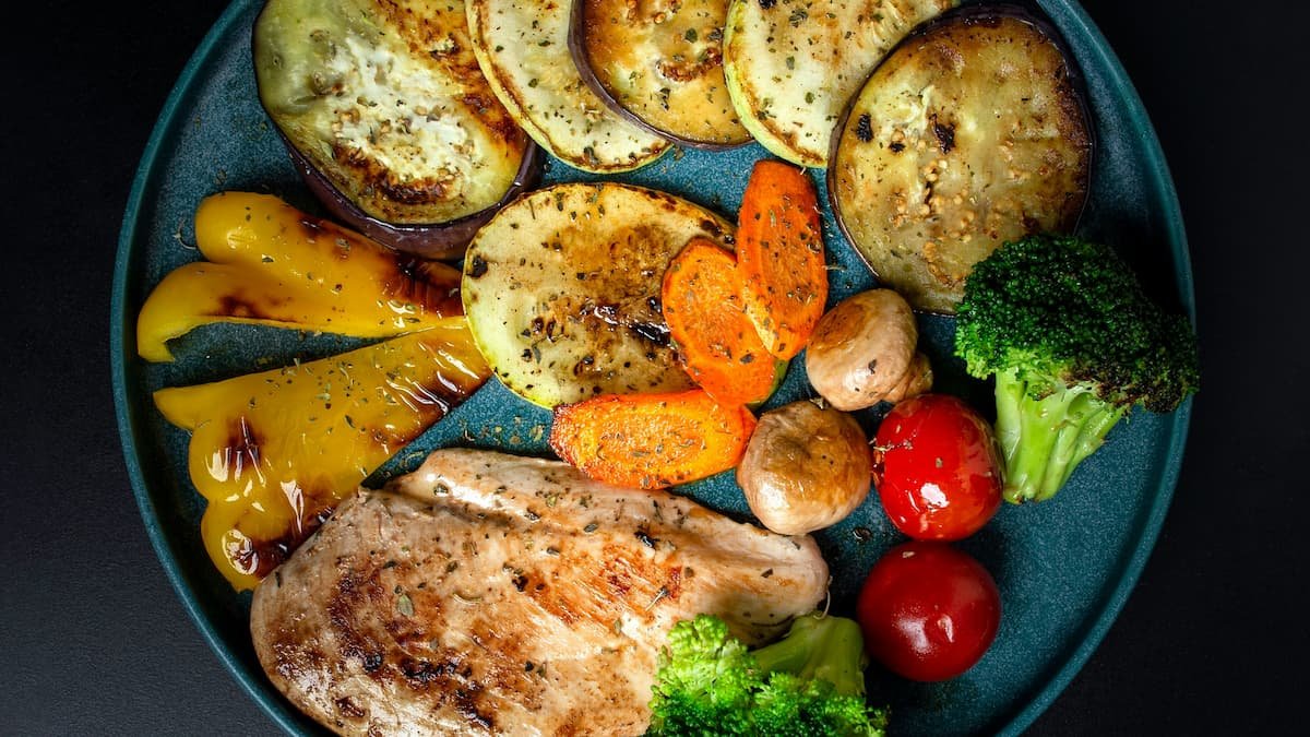 Balanced healthy meal with turkey,  aubergine and leafy greens to improve nutrition quality and energy levels.