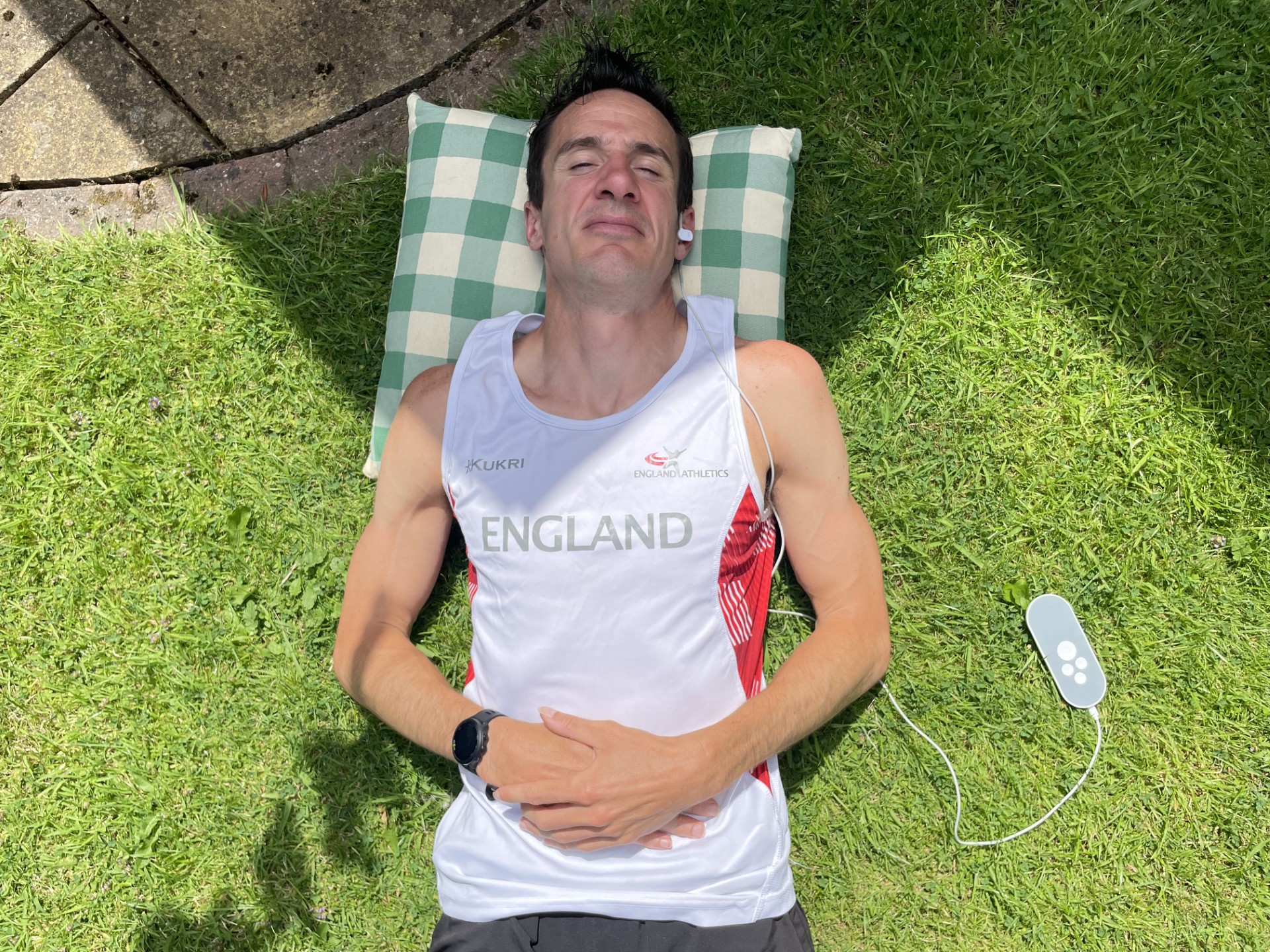 England Masters distance runner using Nurosym device for exercise recovery