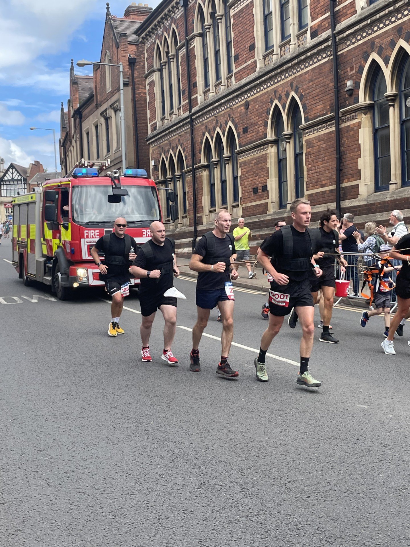 Firefighters completing the Royal Sutton Fun Run 2026 in Sutton Coldfield