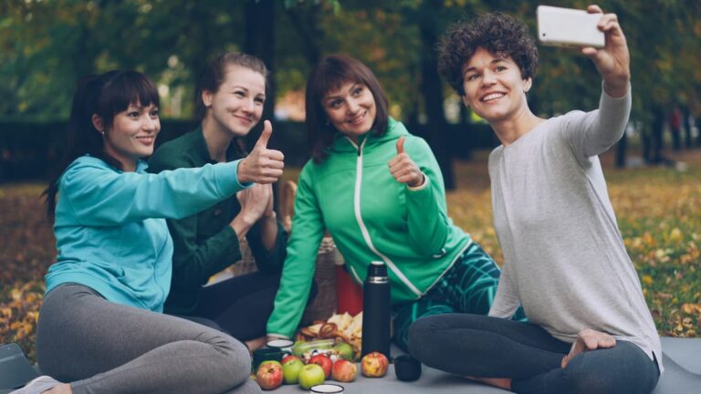 Personal trainer in Sutton Coldfield giving nutrition advice outdoors in Sutton Park.